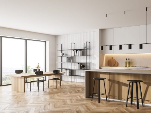 Wooden kitchen room with dining table and chairs, parquet floor, side view. Kitchen open space room with bookshelf and window, light wooden furniture, 3D rendering no people